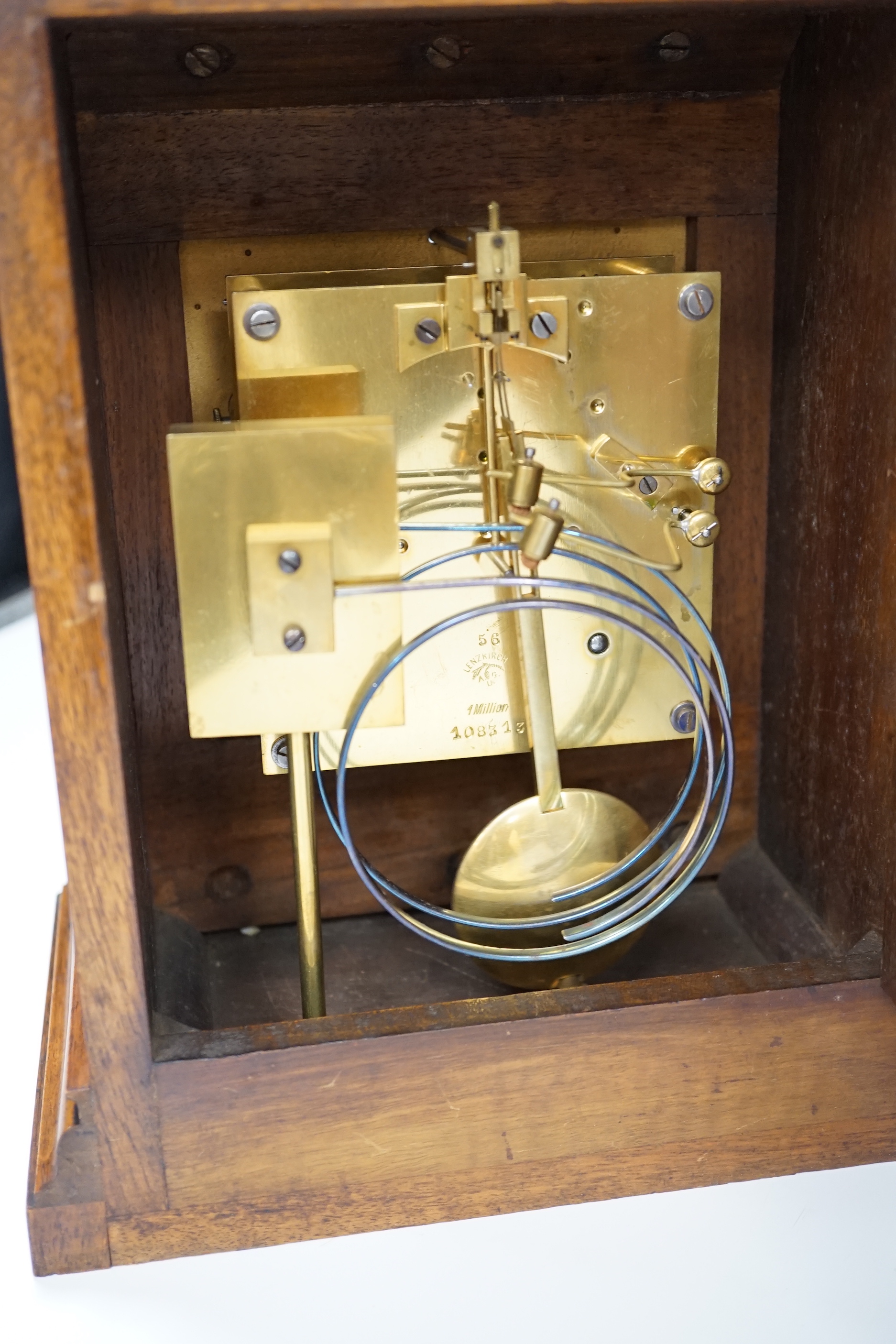 A German Lenzkirch burr walnut mantel clock striking on a coiled gong, 32cm high